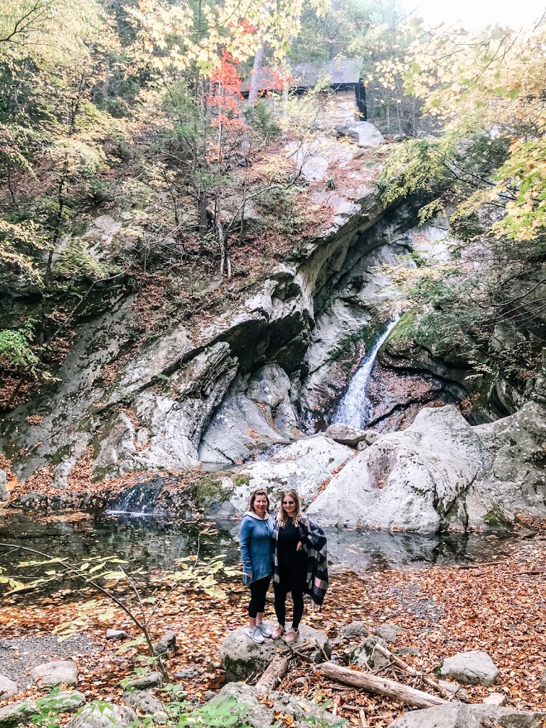 Picture of mom and daughter by a waterfall