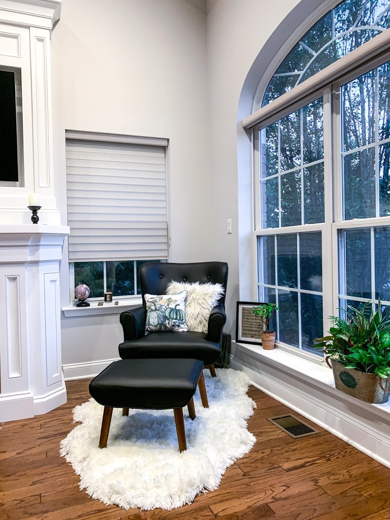 Fall decor on a black mid-century modern accent chair