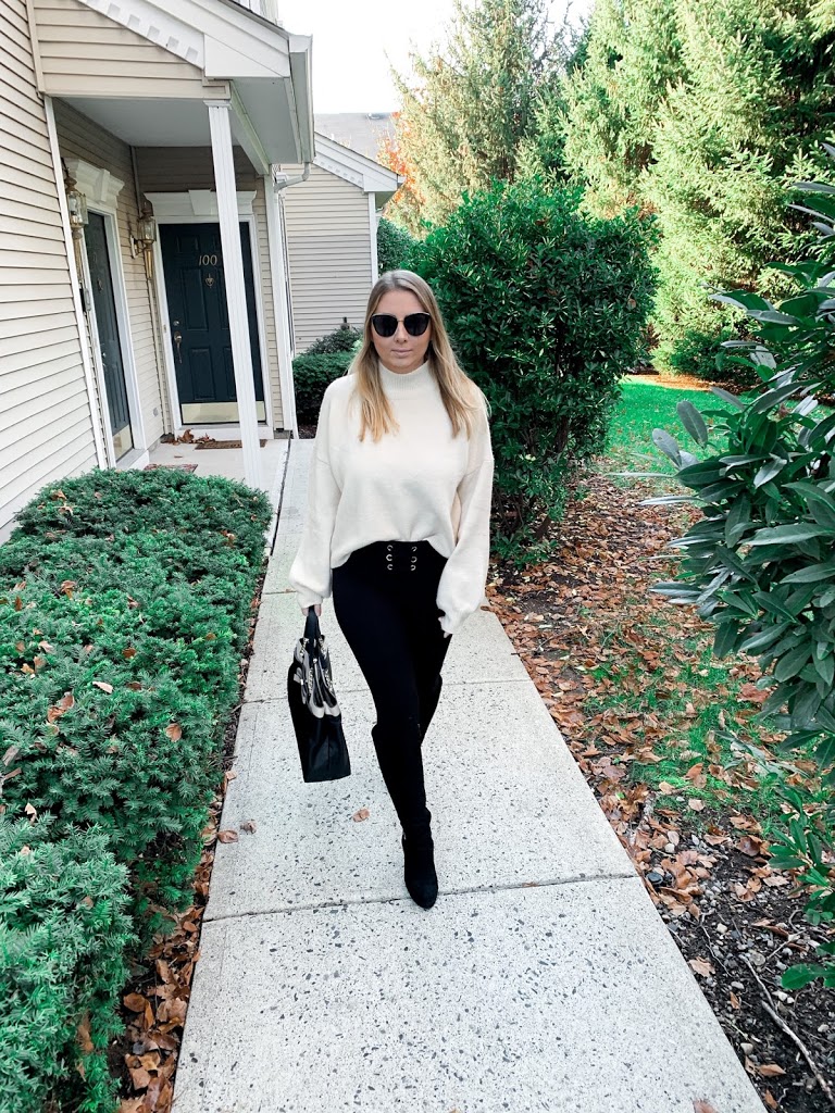 Cream mock neck sweater, black leggings and black boots