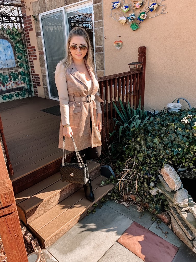 women's fall outfit styled with a vest, faux leather leggings, bodysuit and Kate Spade shoulder handbag