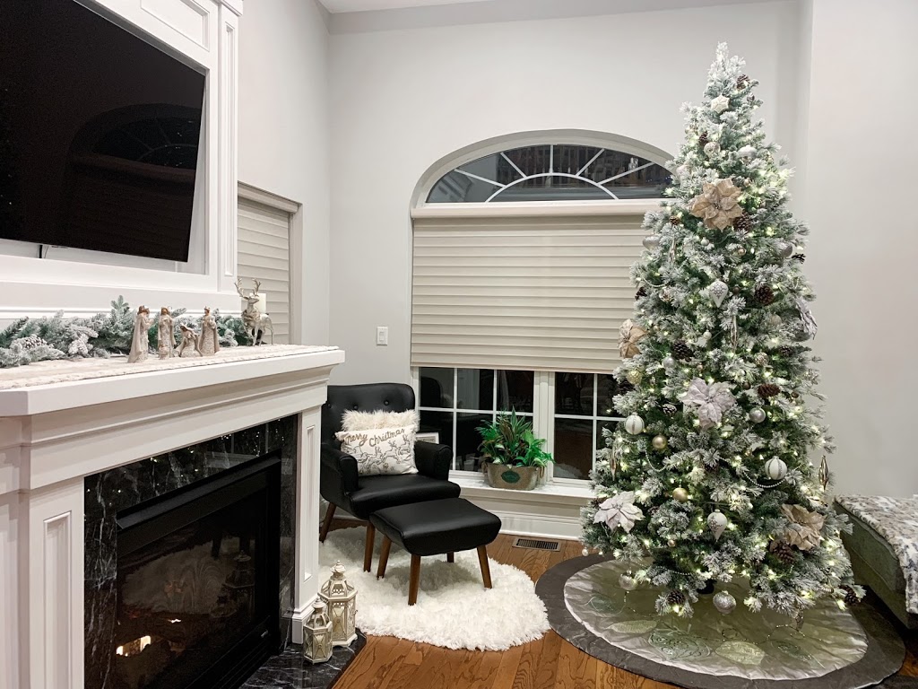 Christmas decor on fireplace mantel and Christmas tree