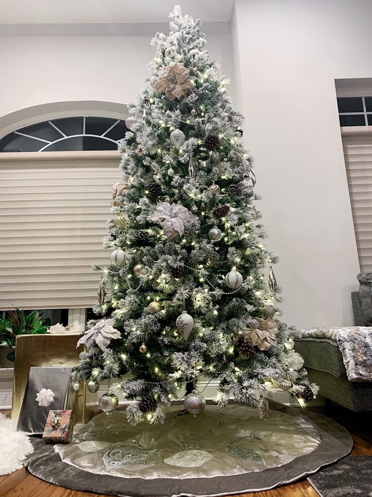 neutral color Christmas tree with gold, silver and white decor