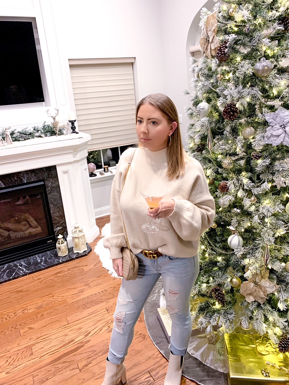 white winter outfit, jeans, sweater and white booties