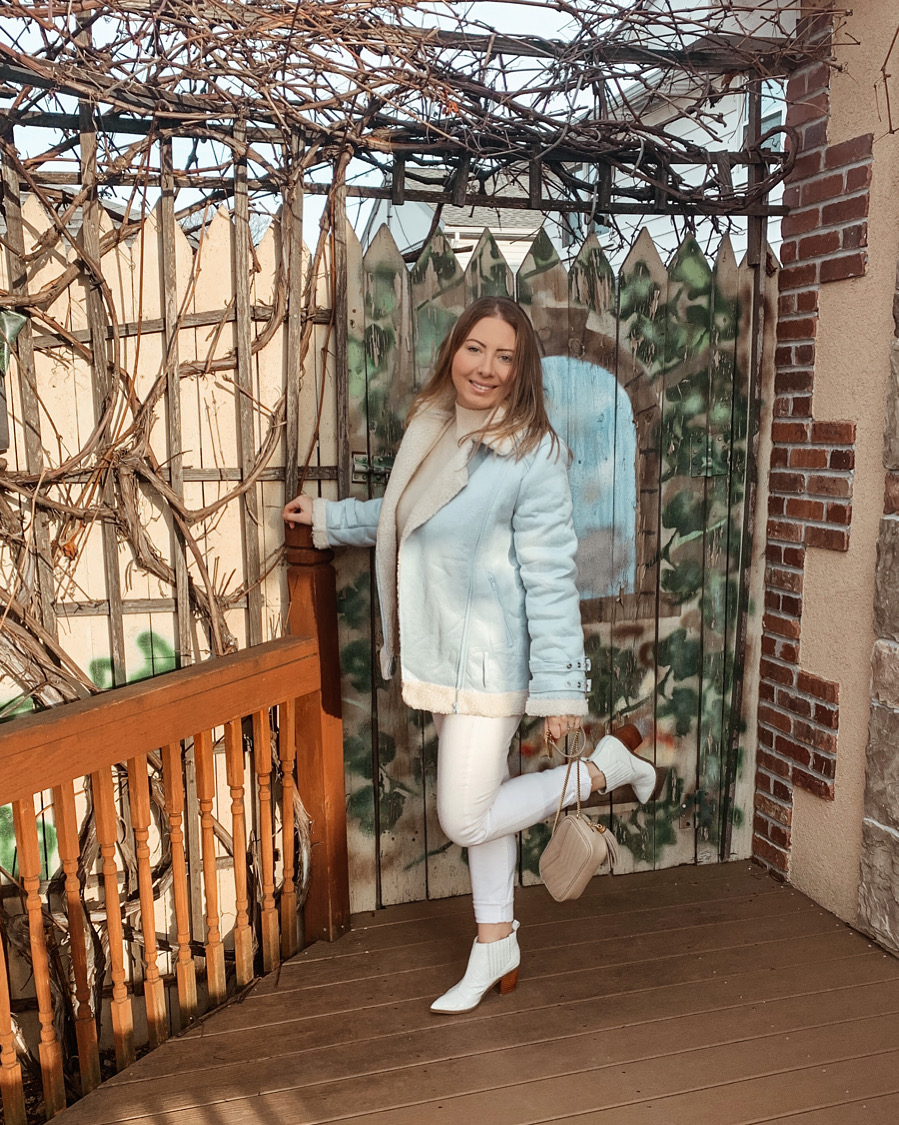 Winter all white neutral outfit with a light blue coat