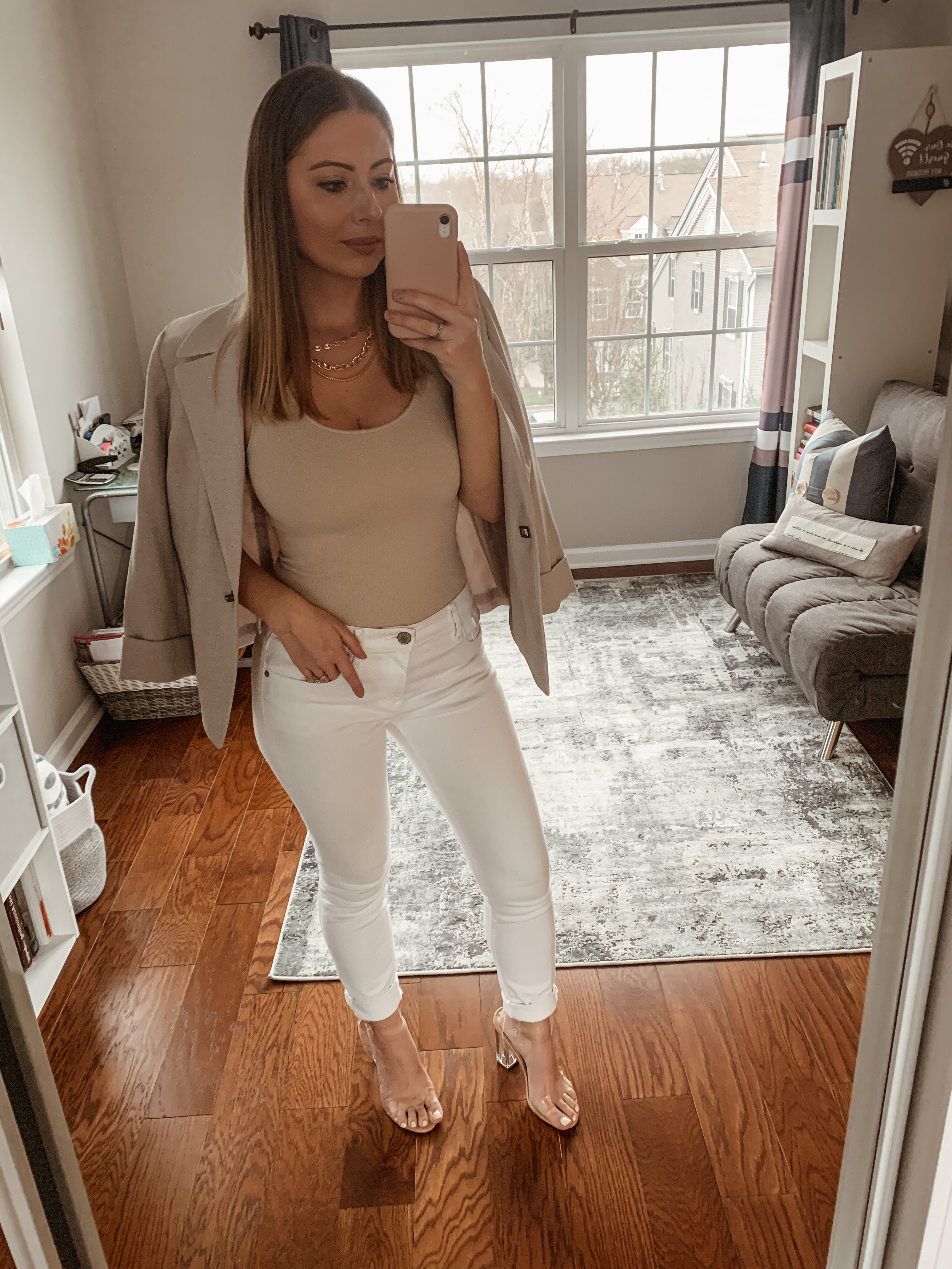 white jeans paired with taupe body suit and beige blazer